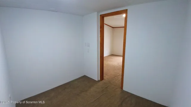 an empty room with mirror