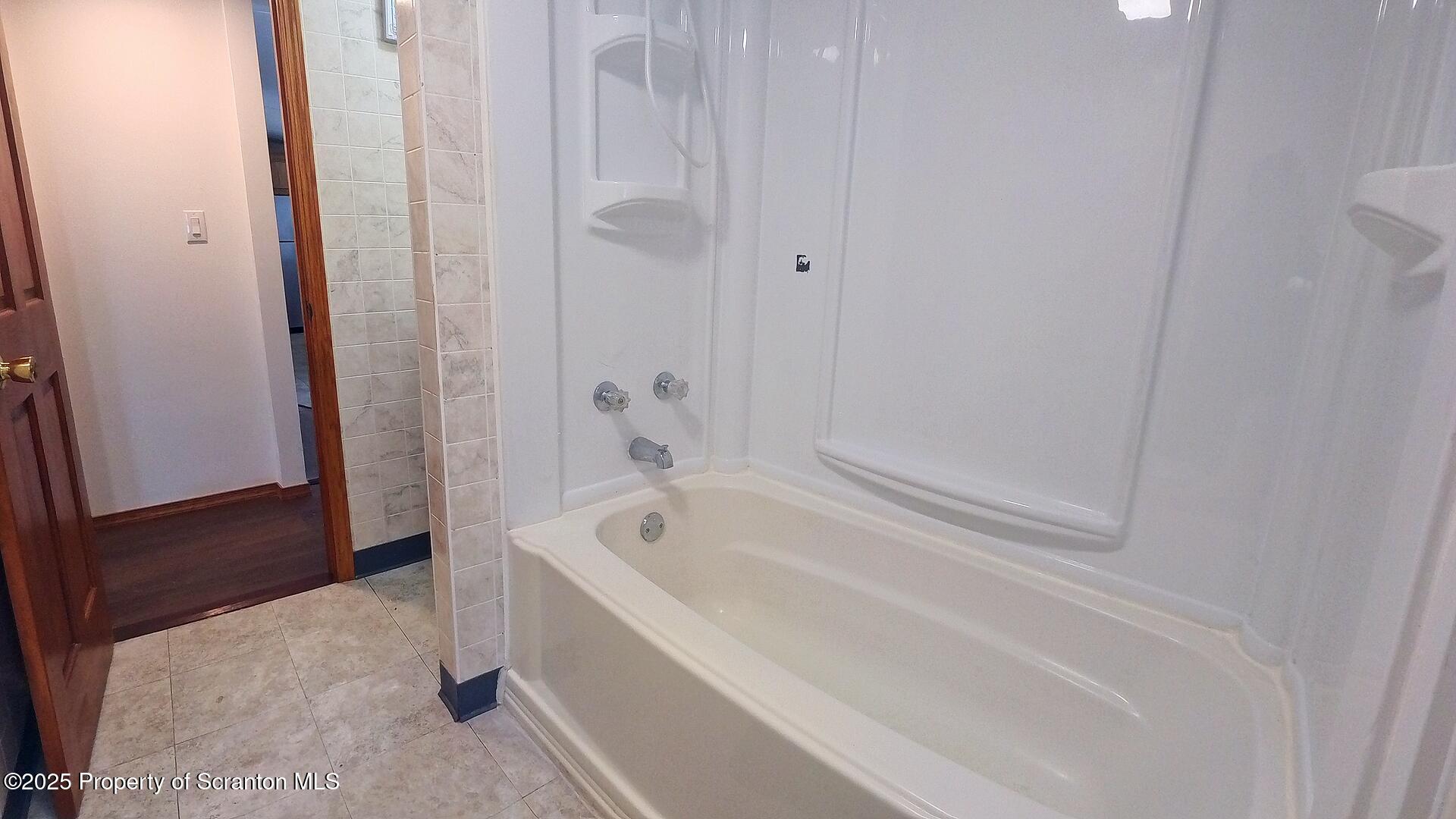 193 South Cedar Street Hazleton, PA 18201 - Photo 10 of 27 a spacious bathroom with a bathtub and shower