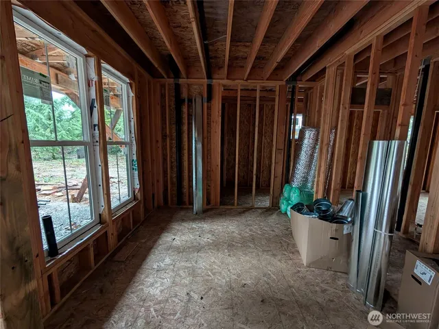 a view of an empty room with wooden walls