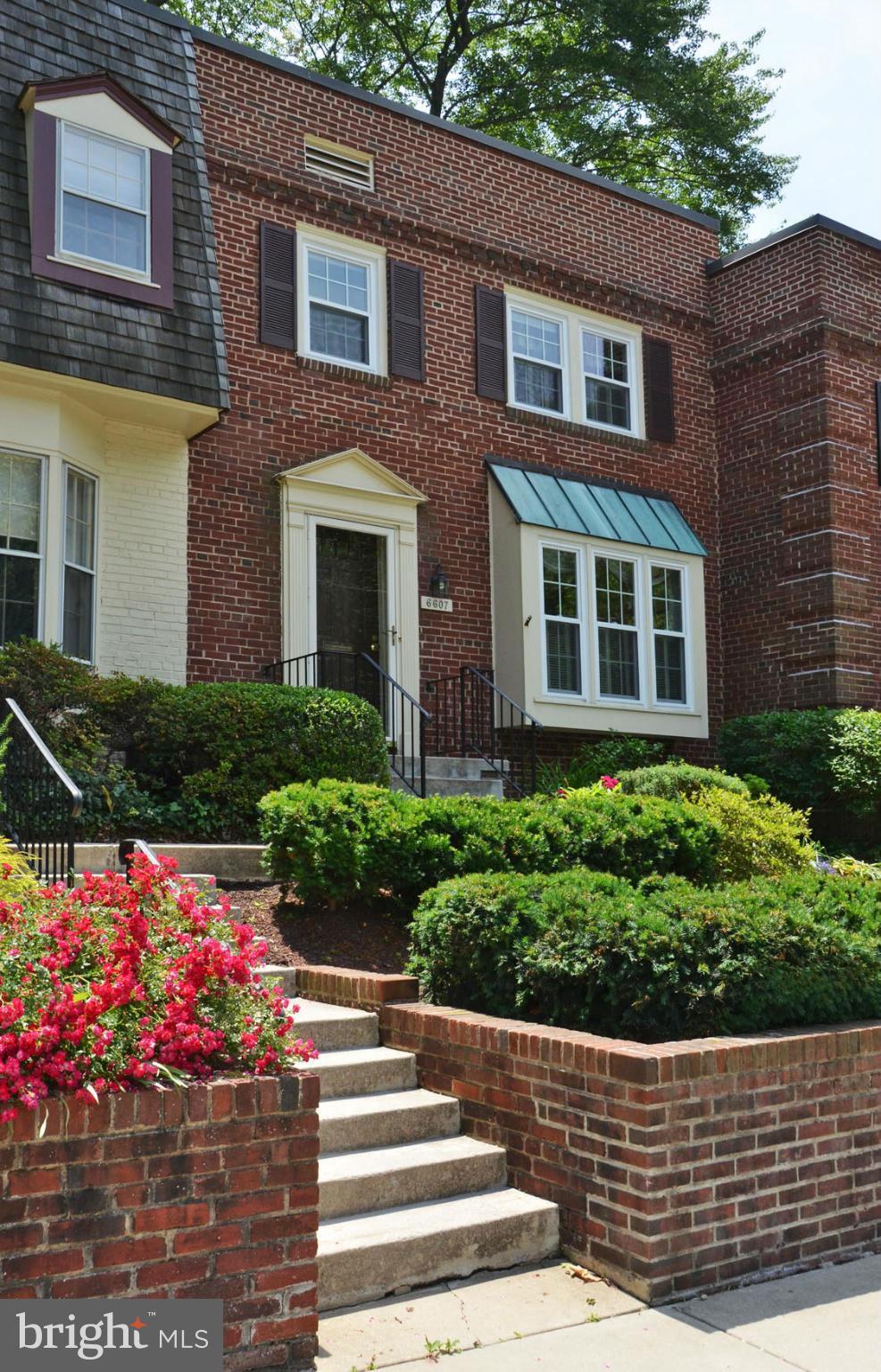 6607 Hillandale Road, Unit 89 Chevy Chase, MD 20815 - Photo 1 of 30 a front view of a house having yard