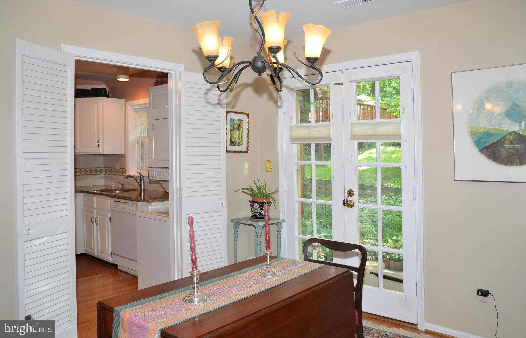 6607 Hillandale Road, Unit 89 Chevy Chase, MD 20815 - Photo 13 of 30 a living room with furniture and a window