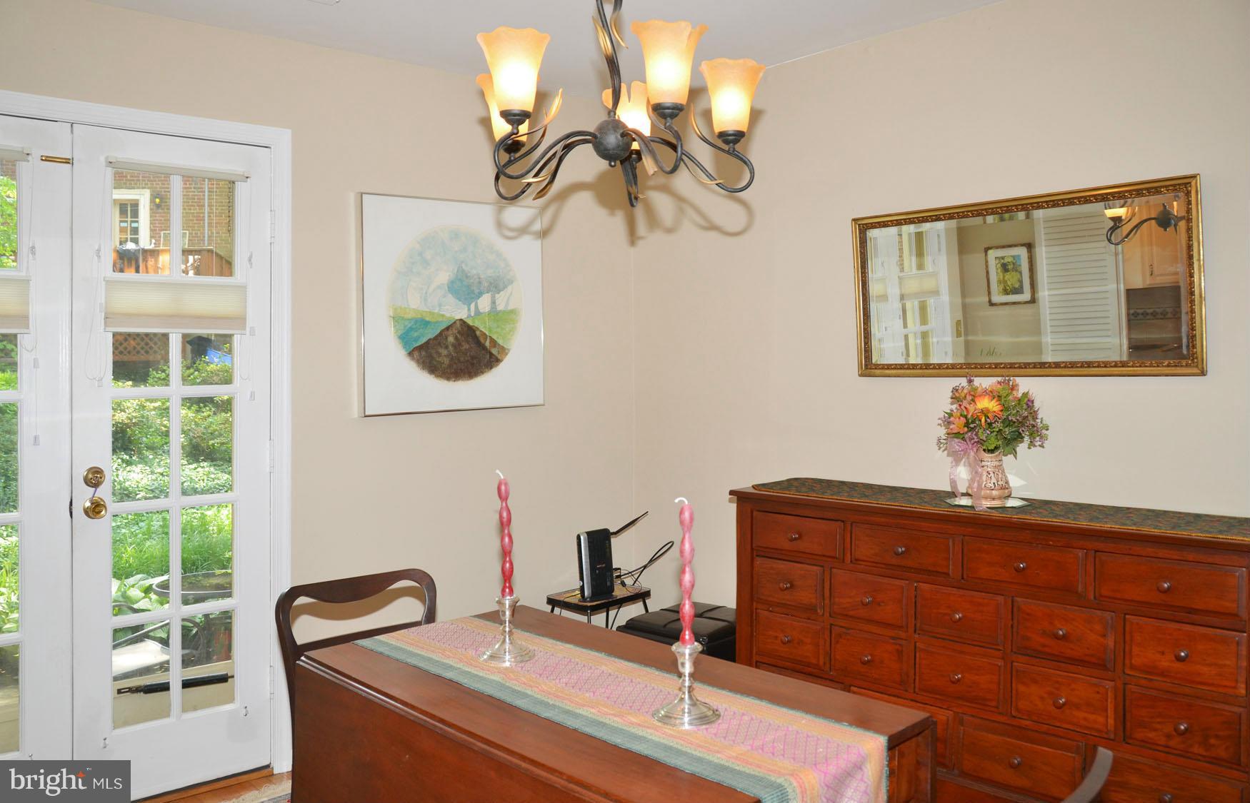 6607 Hillandale Road, Unit 89 Chevy Chase, MD 20815 - Photo 15 of 30 a bathroom with a sink and a mirror