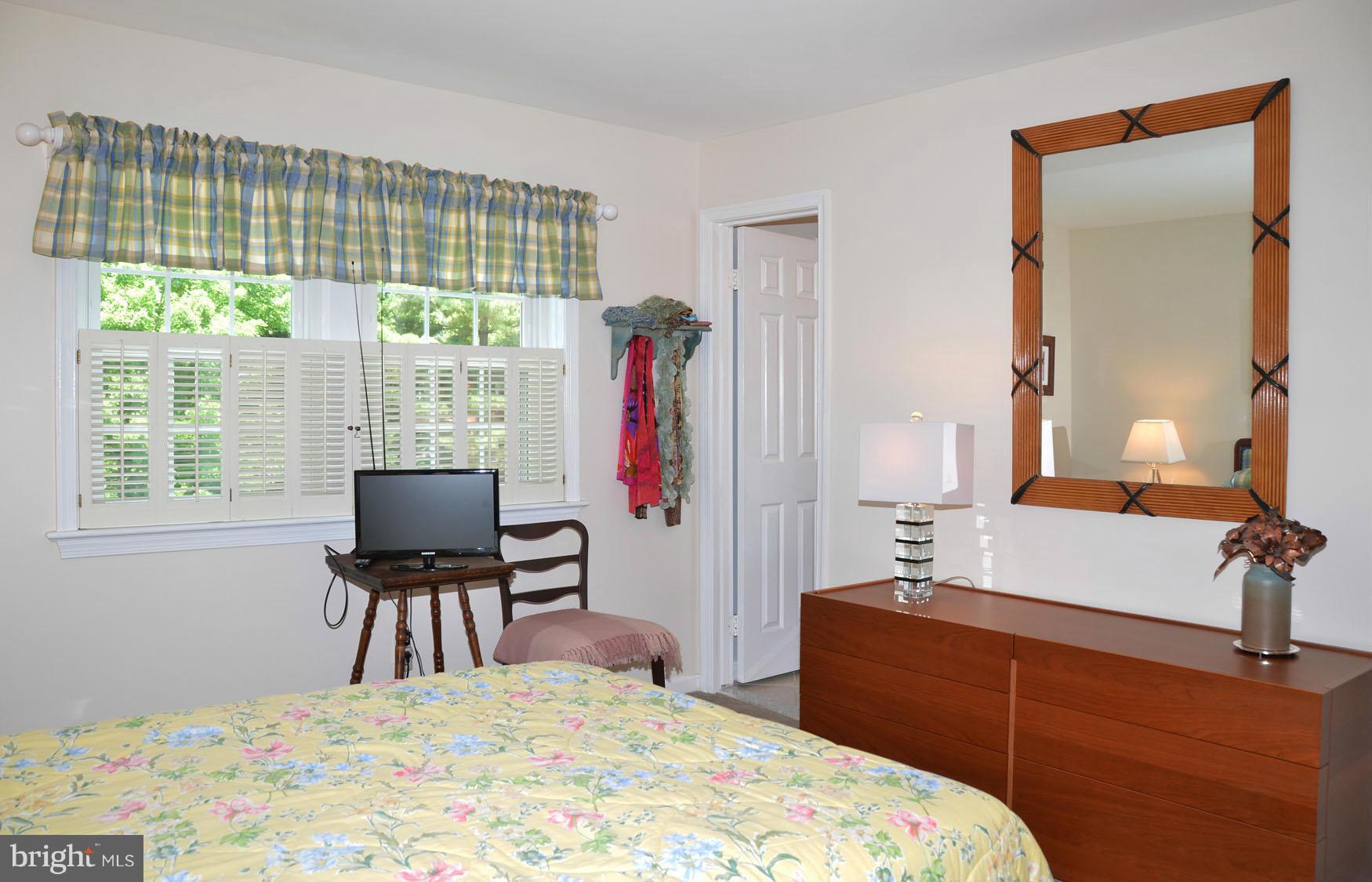 6607 Hillandale Road, Unit 89 Chevy Chase, MD 20815 - Photo 17 of 30 a bedroom with a bed and a window