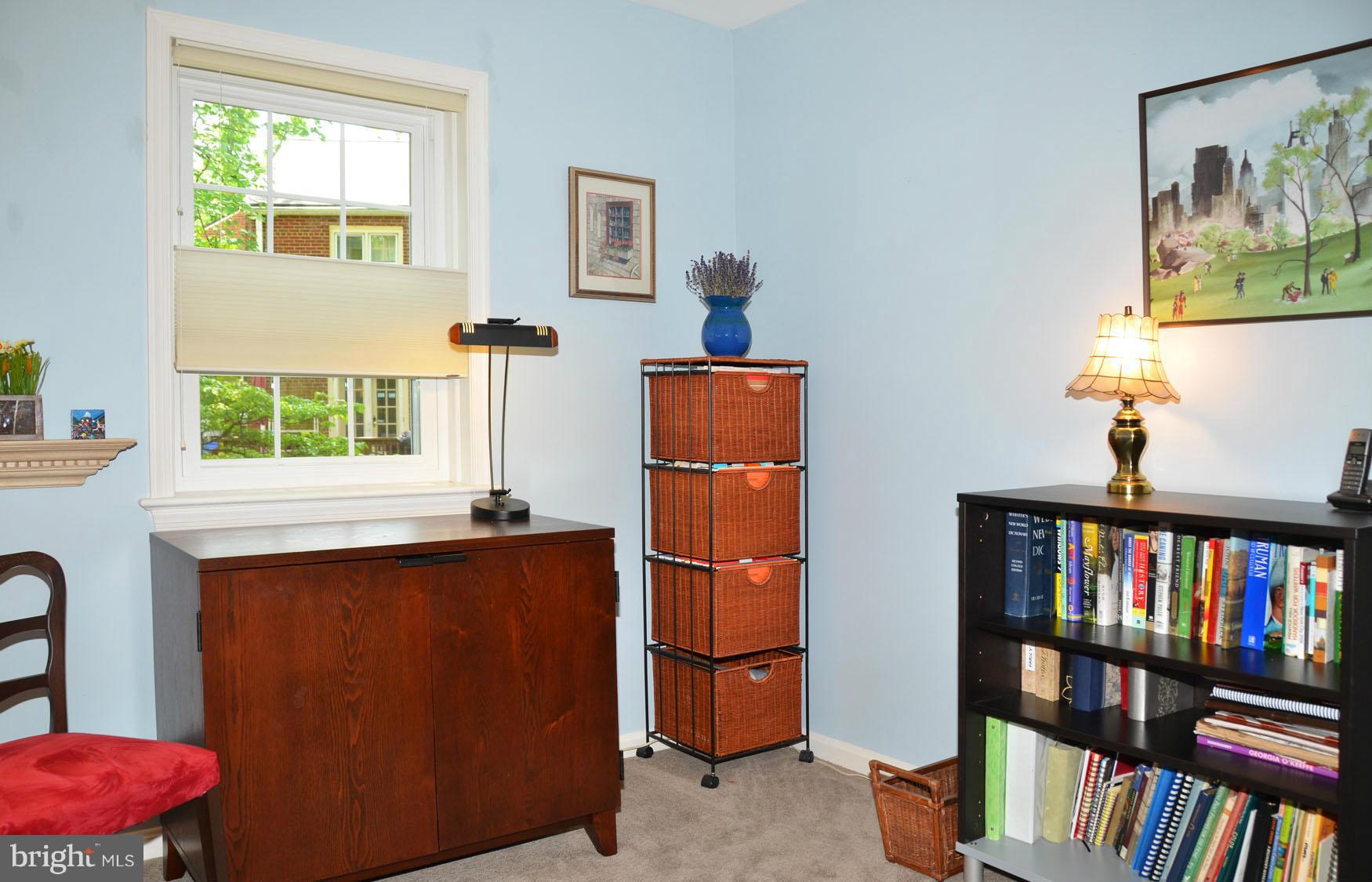 6607 Hillandale Road, Unit 89 Chevy Chase, MD 20815 - Photo 22 of 30 a view of a living room with a baby crib