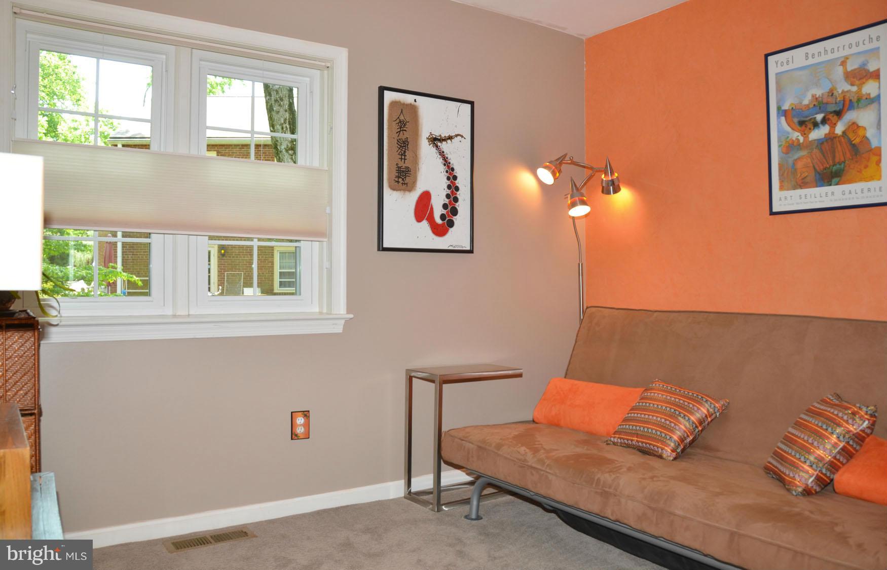 6607 Hillandale Road, Unit 89 Chevy Chase, MD 20815 - Photo 23 of 30 a living room with furniture and a window
