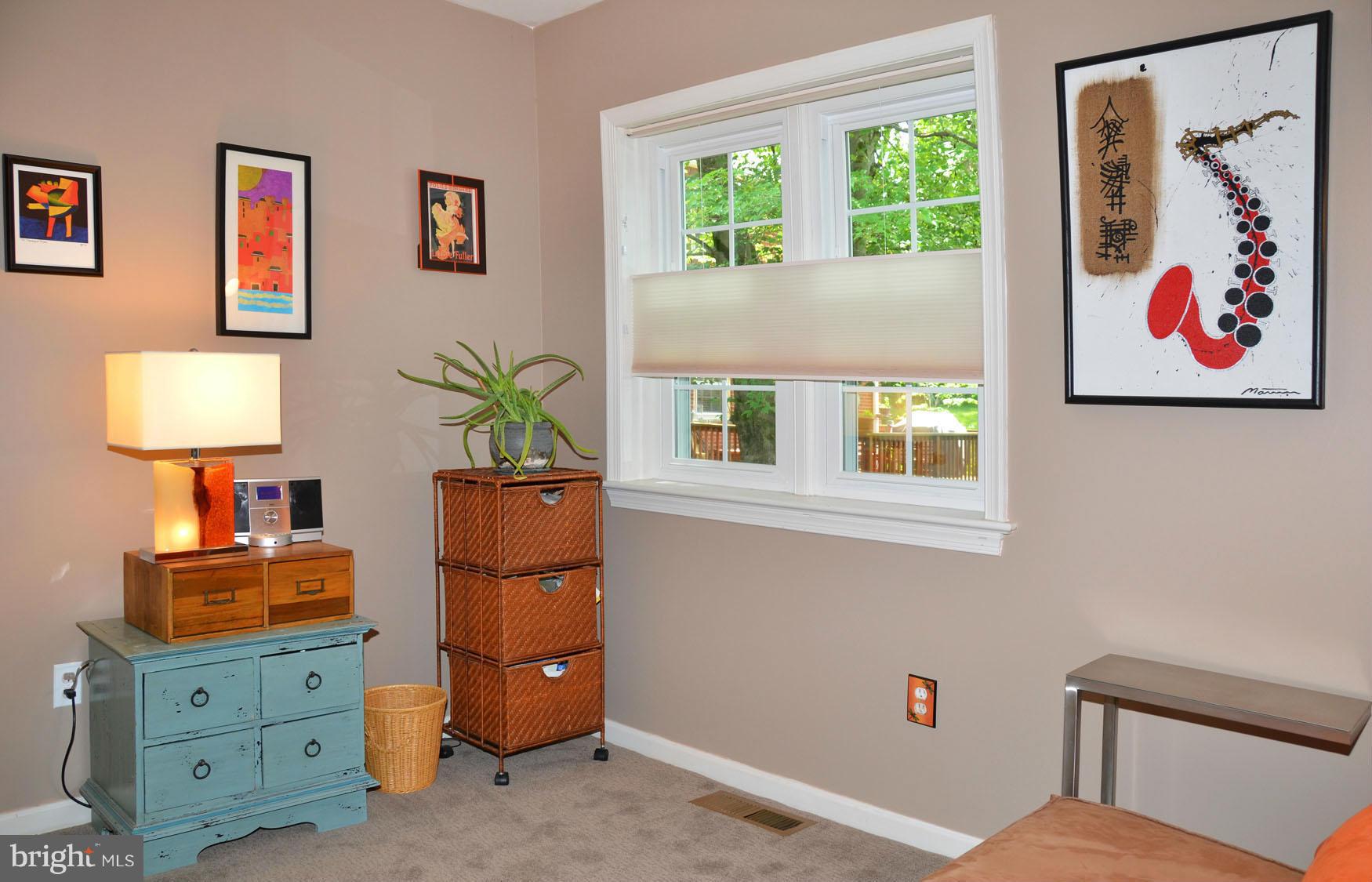 6607 Hillandale Road, Unit 89 Chevy Chase, MD 20815 - Photo 24 of 30 a living room with furniture and a window