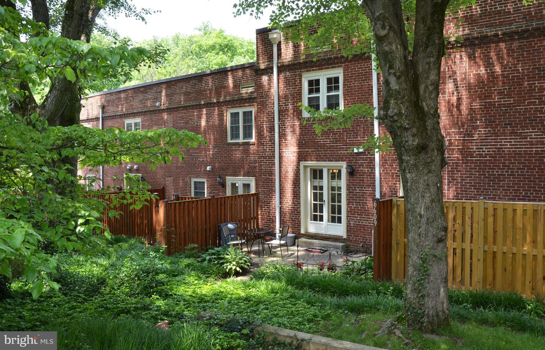 6607 Hillandale Road, Unit 89 Chevy Chase, MD 20815 - Photo 27 of 30 front view of a house with a yard