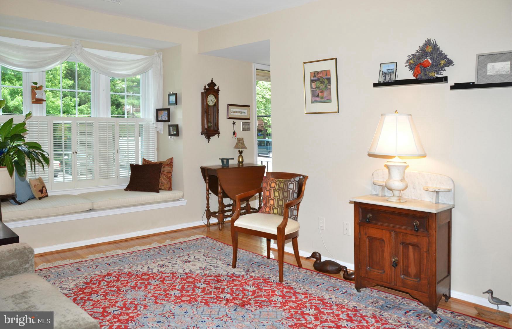 6607 Hillandale Road, Unit 89 Chevy Chase, MD 20815 - Photo 7 of 30 a living room with furniture and a table