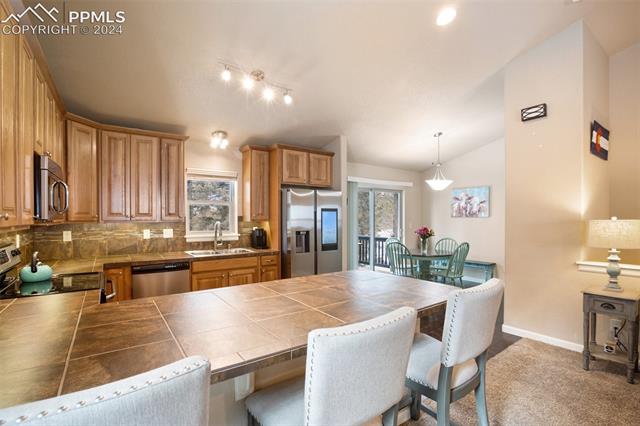 31 Wahsatch Road Florissant, CO 80816 - Photo 12 of 46 Open concept with living room, kitchen and dining area