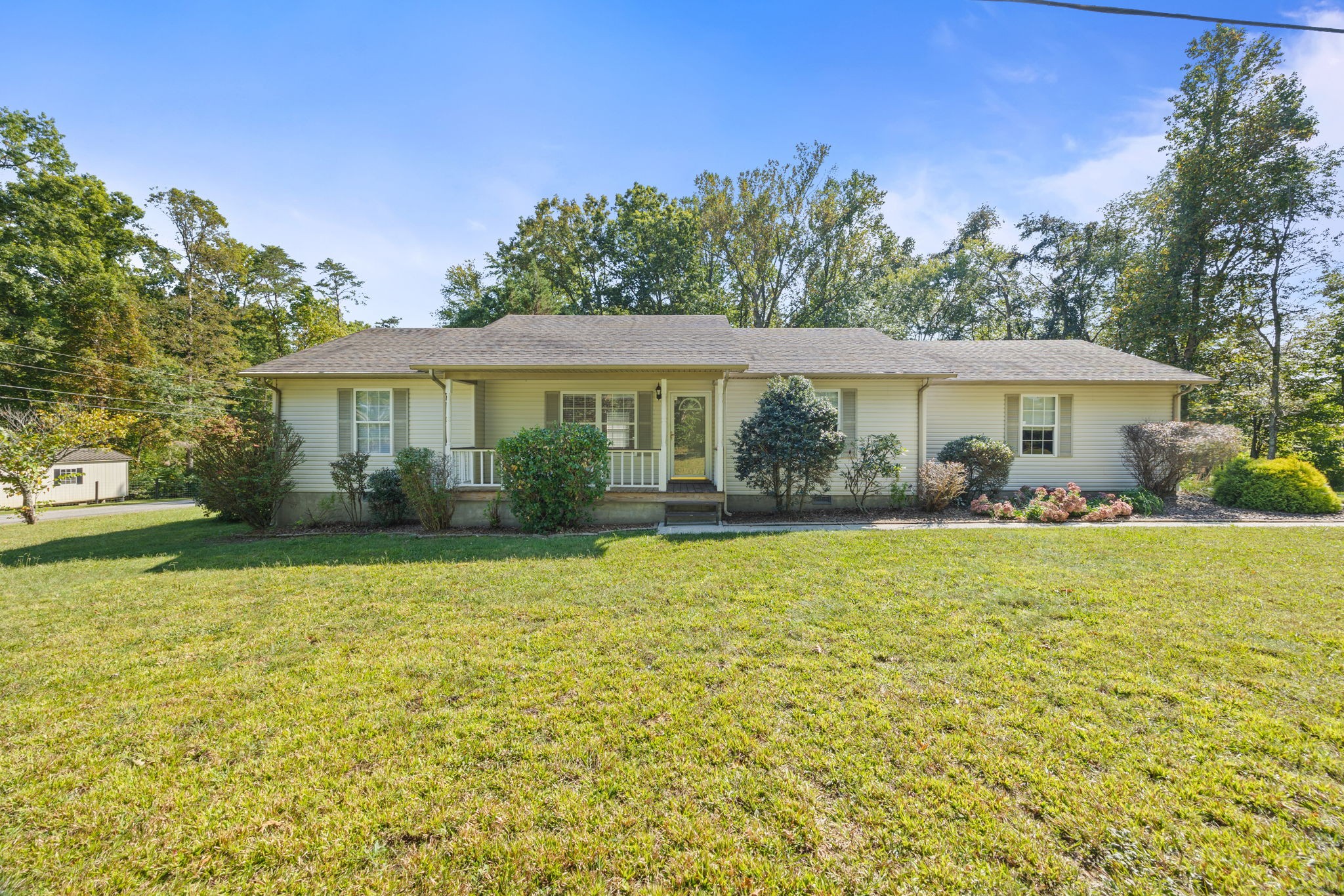 a view of a house with a backyard