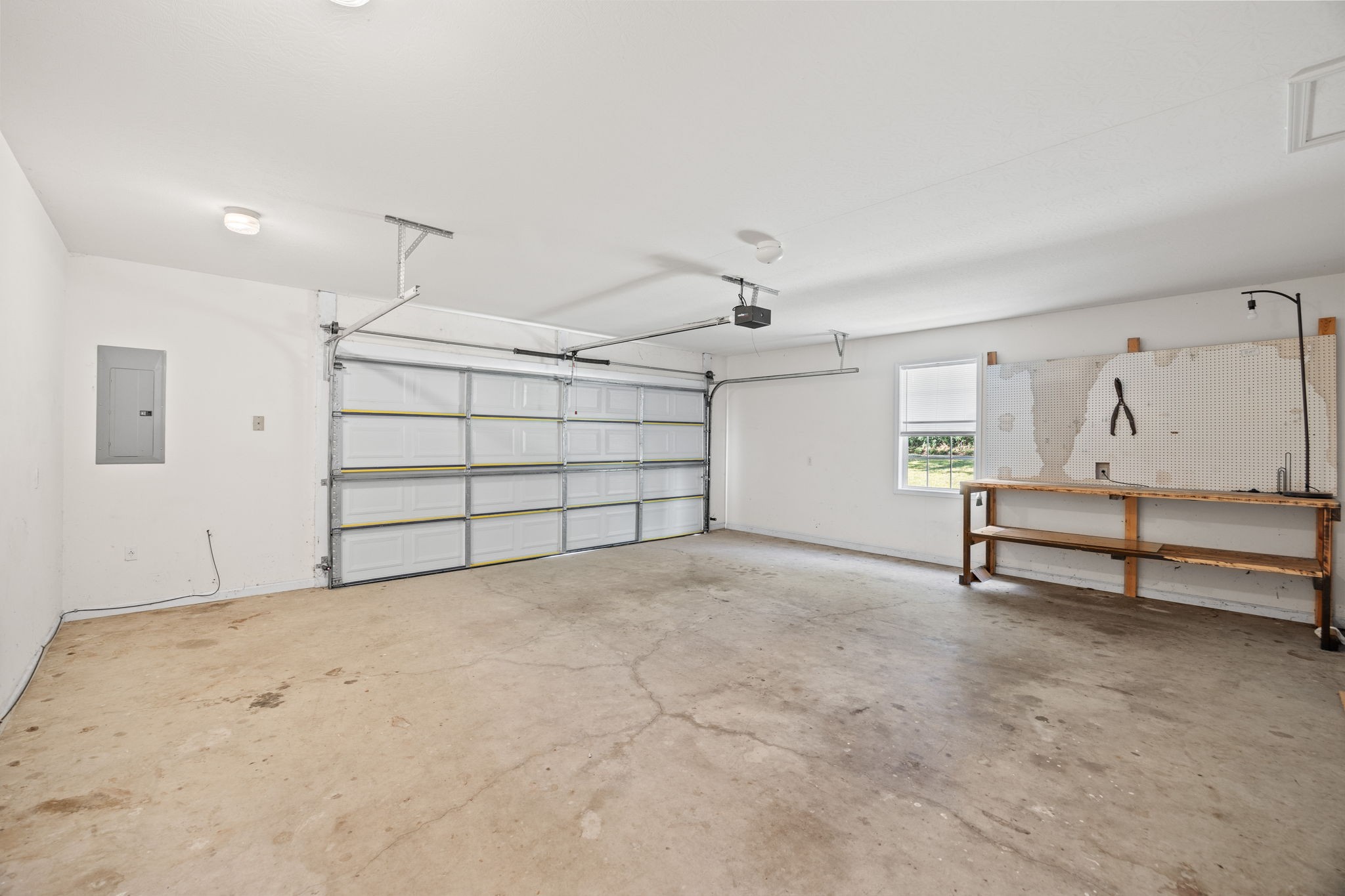 1357 Franklin Loop Clarkrange, TN 38553 - Photo 18 of 37 an empty room with chandelier fan and wooden floor