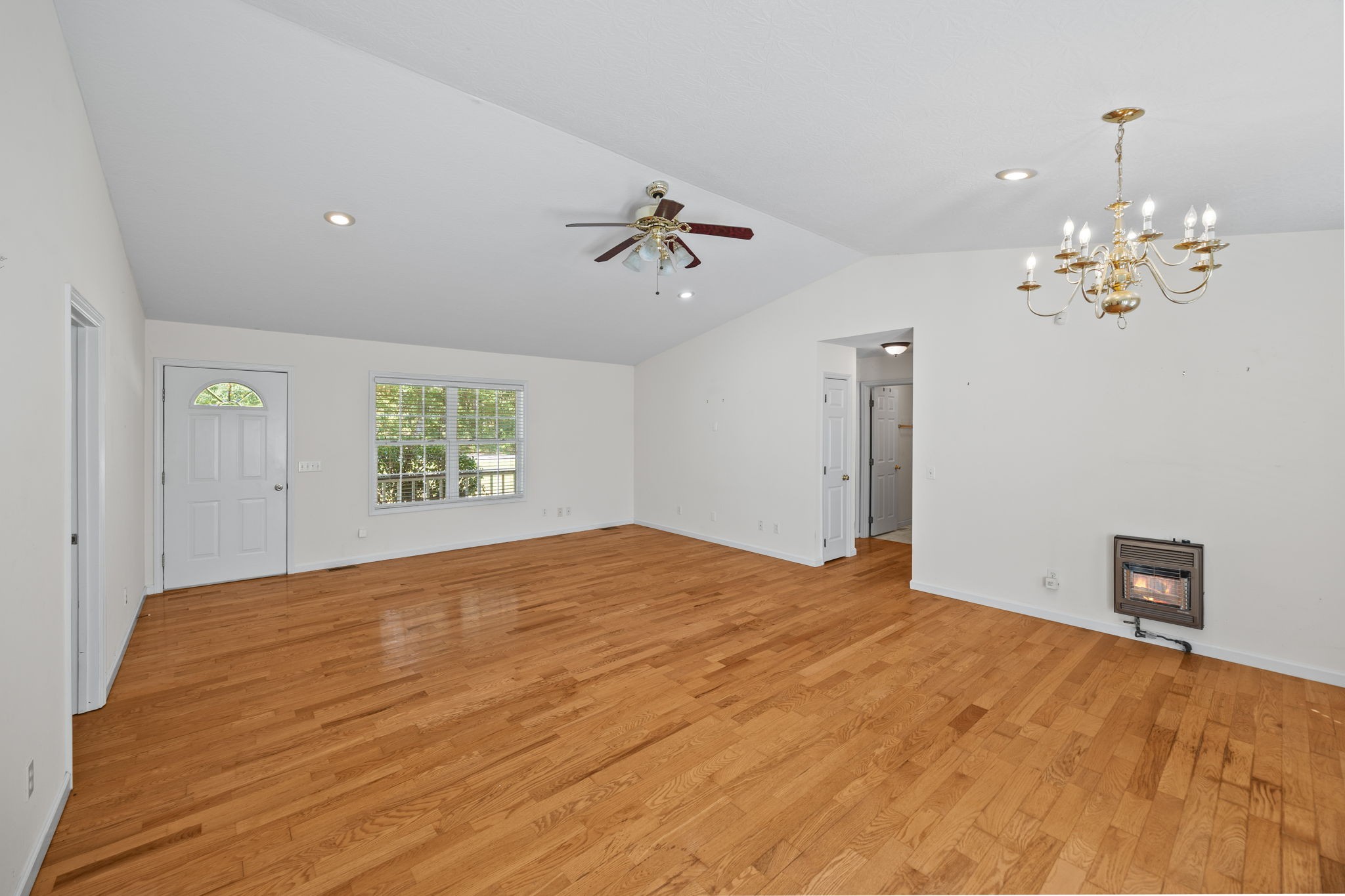 1357 Franklin Loop Clarkrange, TN 38553 - Photo 4 of 37 a bedroom with a bed and a chandelier