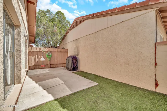 a view of a backyard of the house