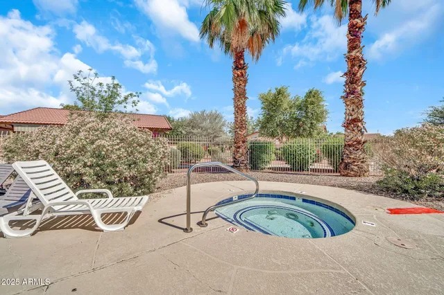 a view of a terrace with a bench and potted plants