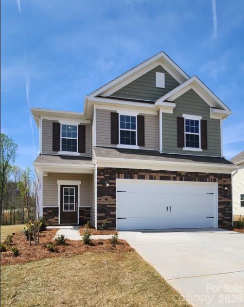 7020 Juneberry Way Maiden, NC 28650 - Photo 1 of 25 a front view of a house with yard and parking space