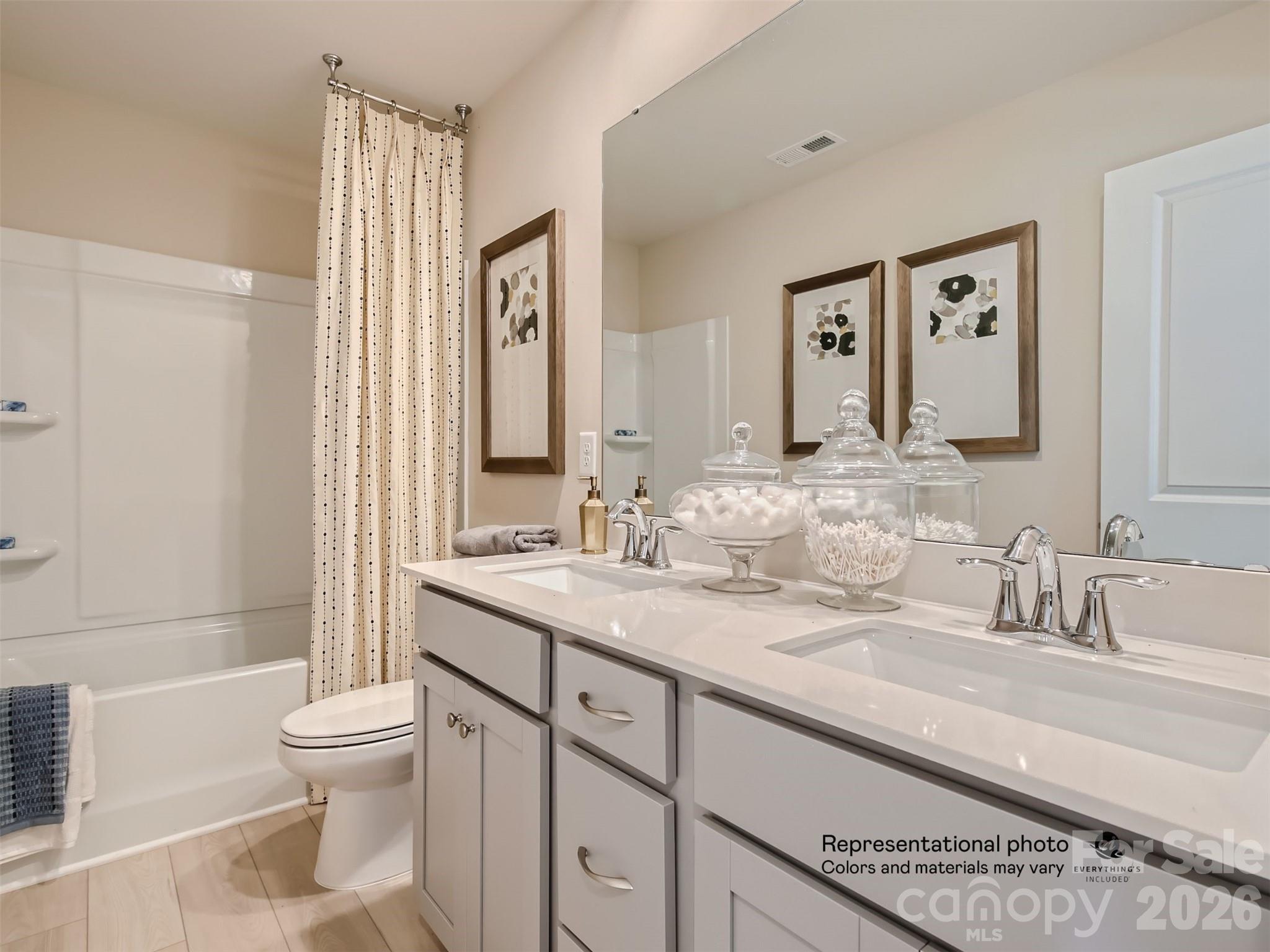 7020 Juneberry Way Maiden, NC 28650 - Photo 17 of 25 a bathroom with a granite countertop sink toilet and shower