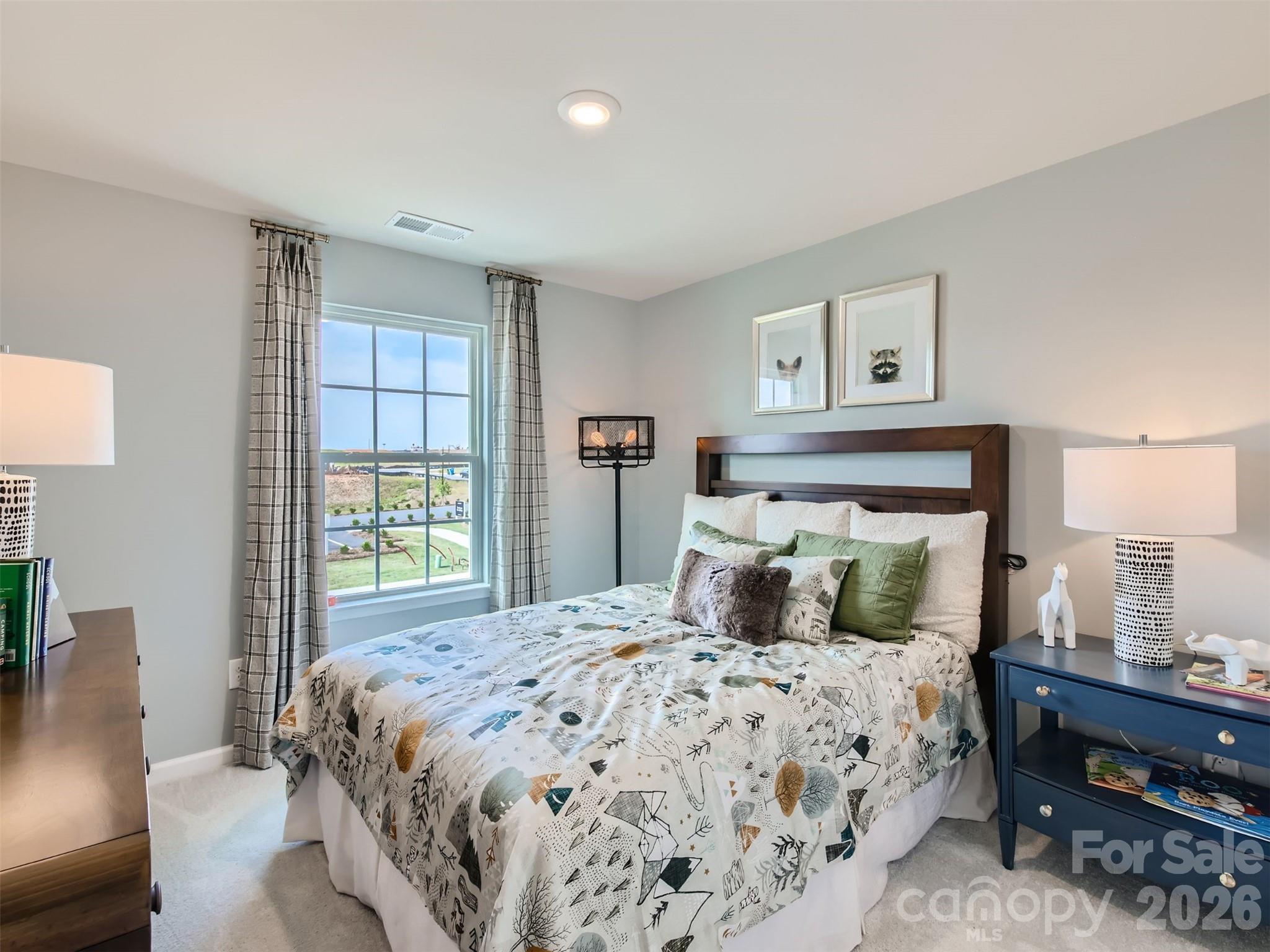 7020 Juneberry Way Maiden, NC 28650 - Photo 18 of 25 a bedroom with a large bed and a window