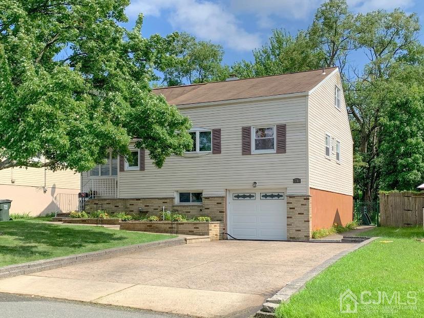 74 Brandywine Road Fords, NJ 08863 - Photo 1 of 16 a house view with a garden space