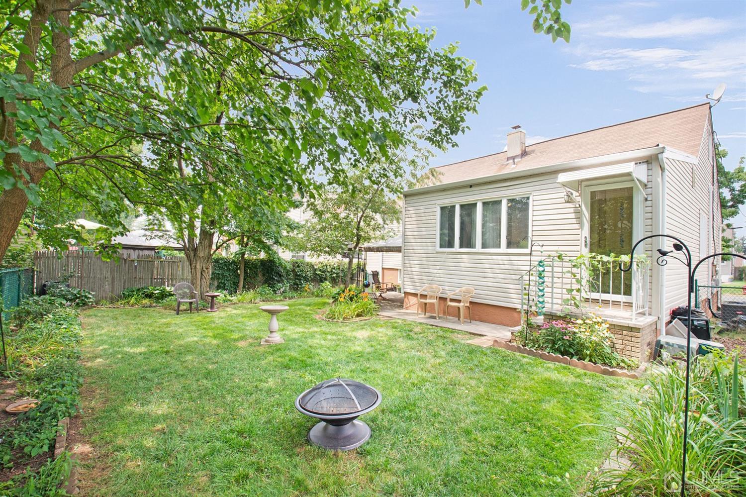 74 Brandywine Road Fords, NJ 08863 - Photo 16 of 16 a view of a house with backyard and sitting area