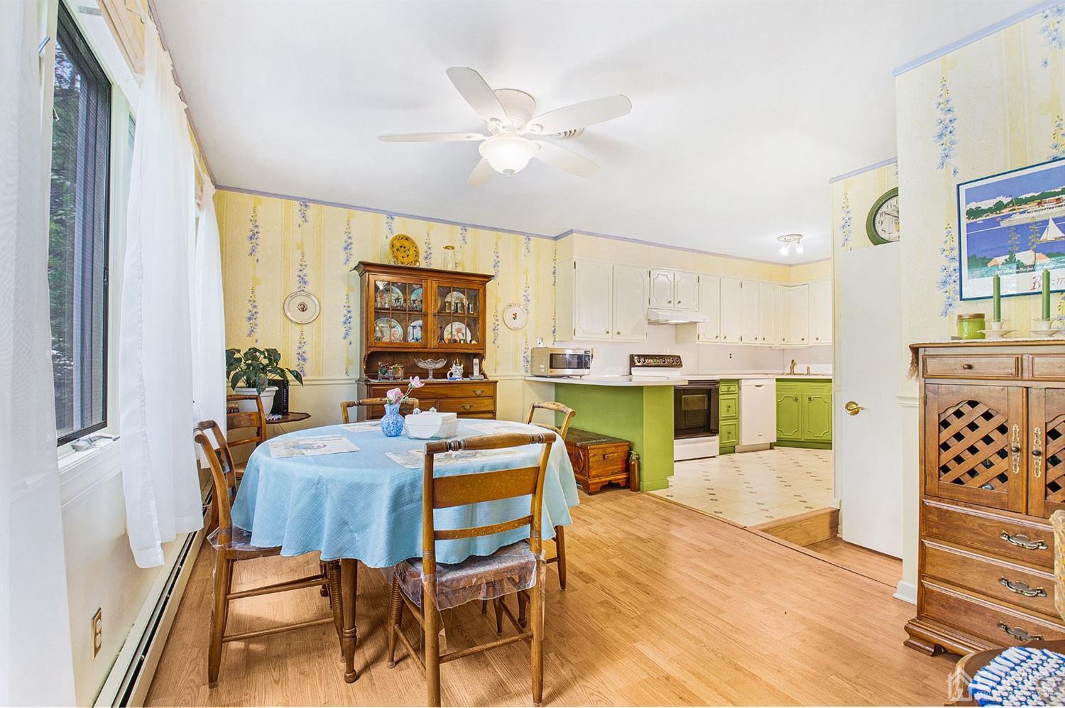 74 Brandywine Road Fords, NJ 08863 - Photo 6 of 16 a living room with furniture a fireplace and a large window