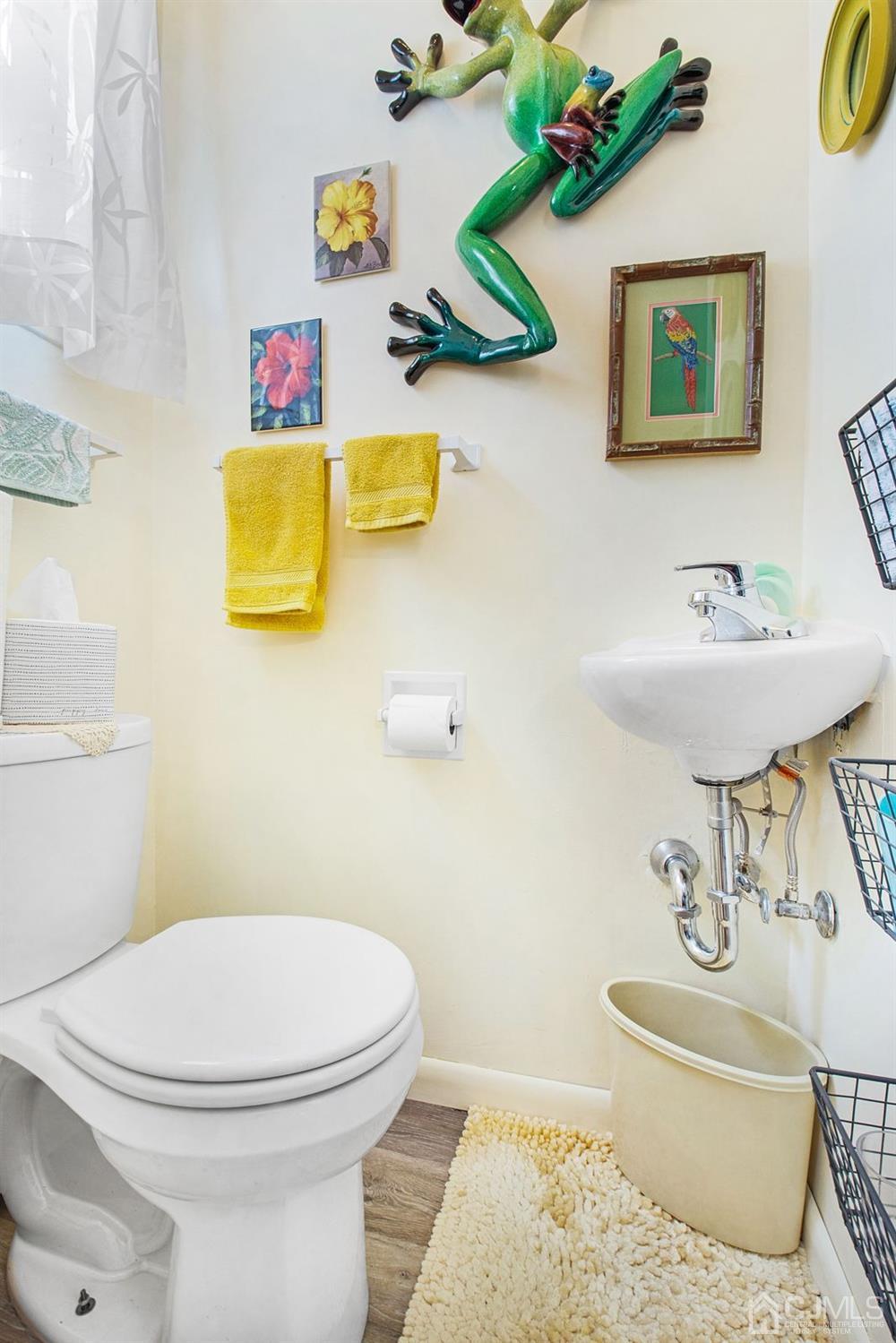 74 Brandywine Road Fords, NJ 08863 - Photo 9 of 16 a bathroom with a toilet sink and mirror