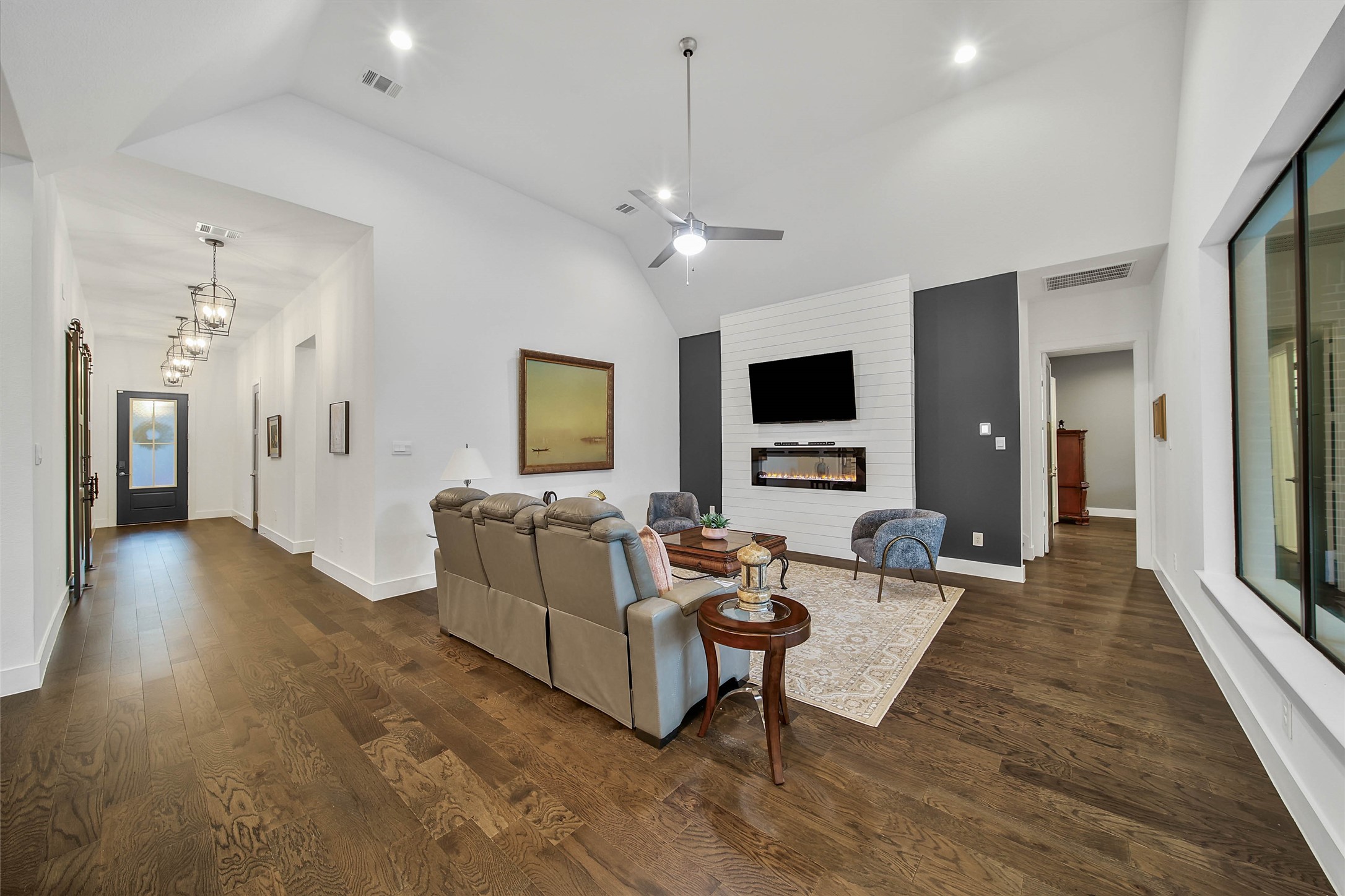 1015 Oak Briar Lane Conroe, TX 77384 - Photo 11 of 50 a living room with furniture and a flat screen tv