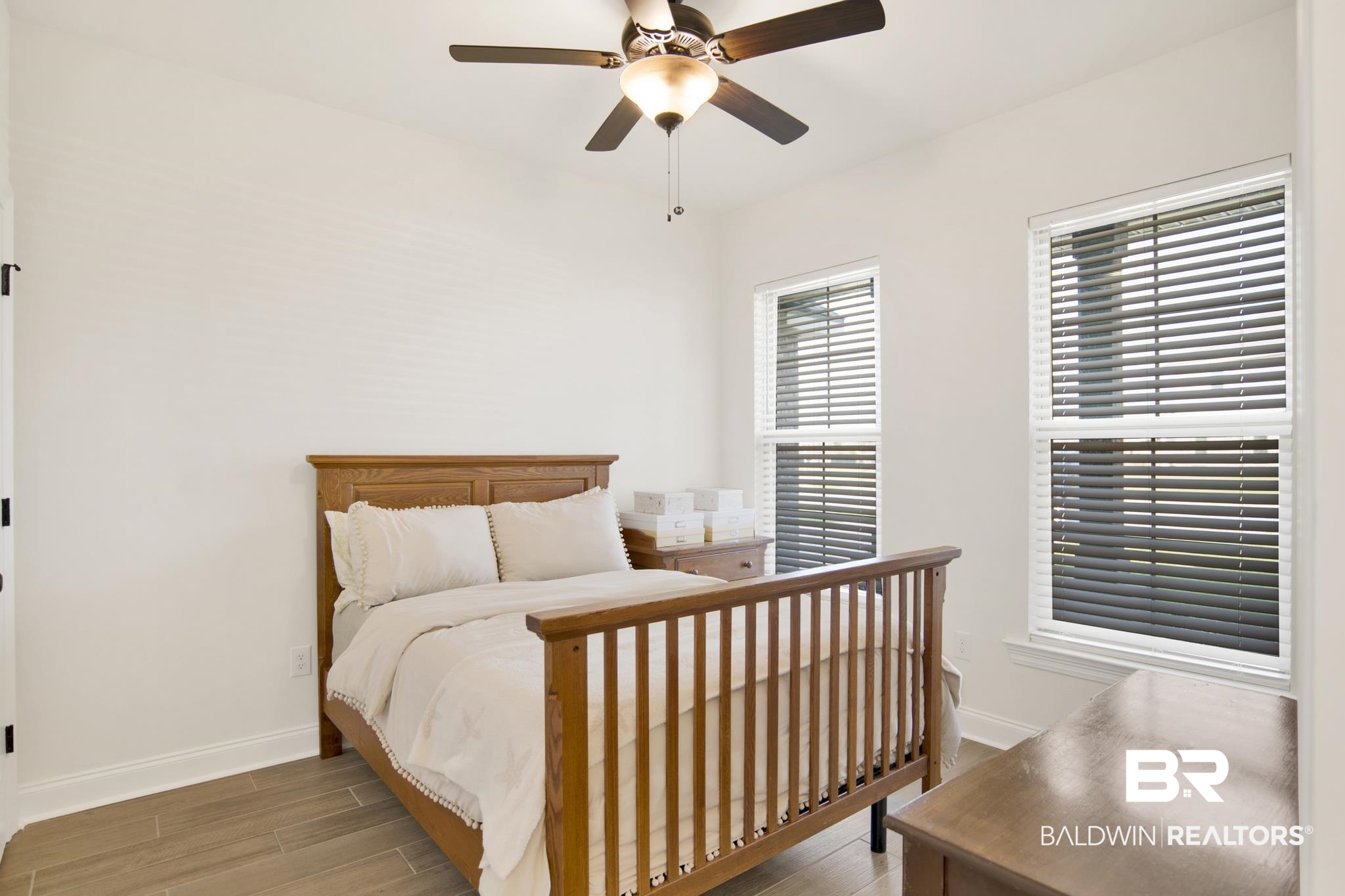 22258 Hibiscus Circle Foley, AL 36535 - Photo 19 of 26 Bedroom with a ceiling fan, wood finished floors, and baseboards