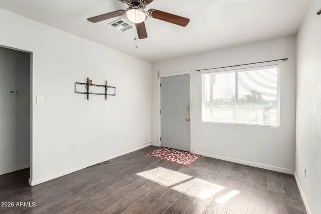 a view of an empty room with a window