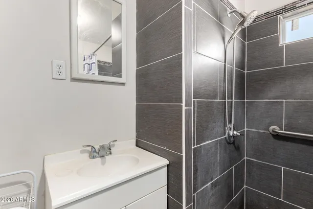 a bathroom with a sink and a mirror