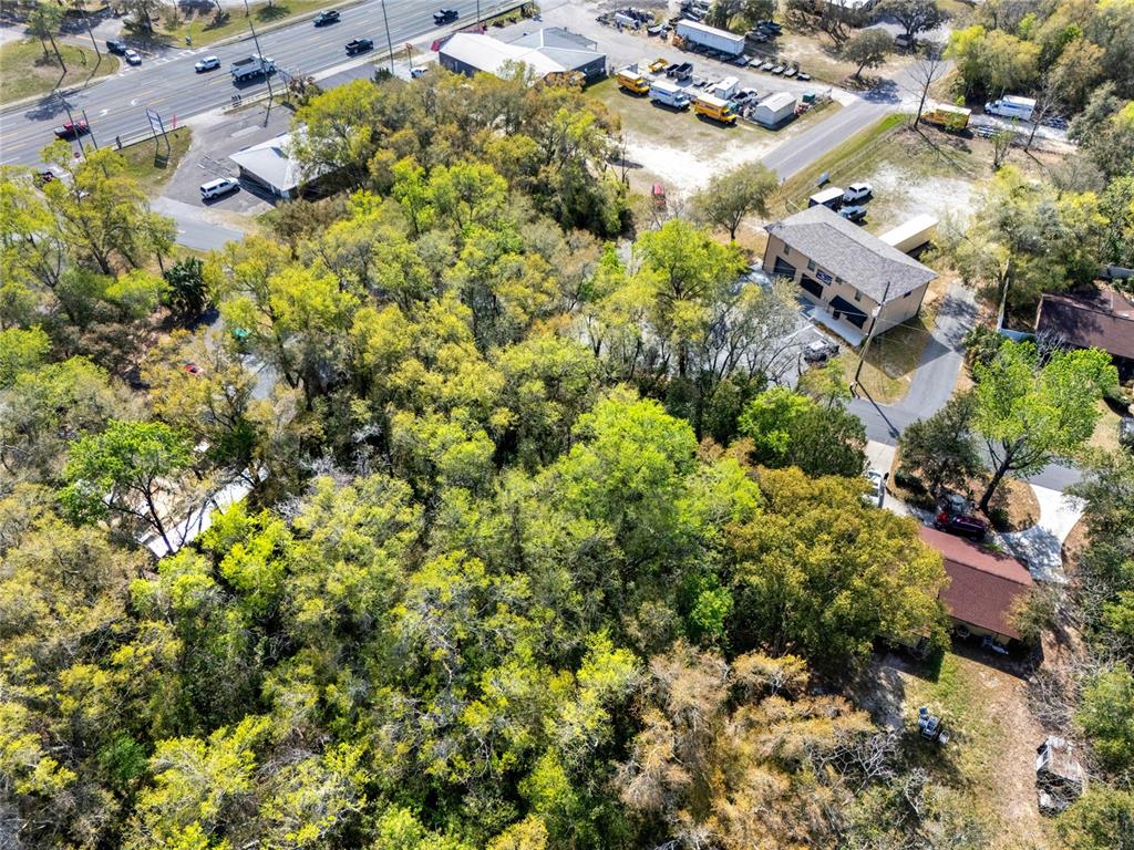 709 South Smith Avenue Inverness, FL 34453 - Photo 17 of 17 an aerial view of residential houses with outdoor space