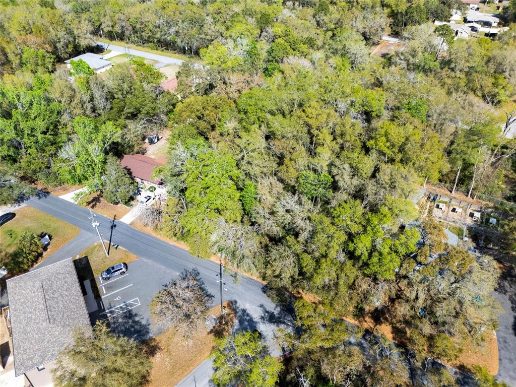709 South Smith Avenue Inverness, FL 34453 - Photo 6 of 17 an aerial view of a house with a yard and lake view