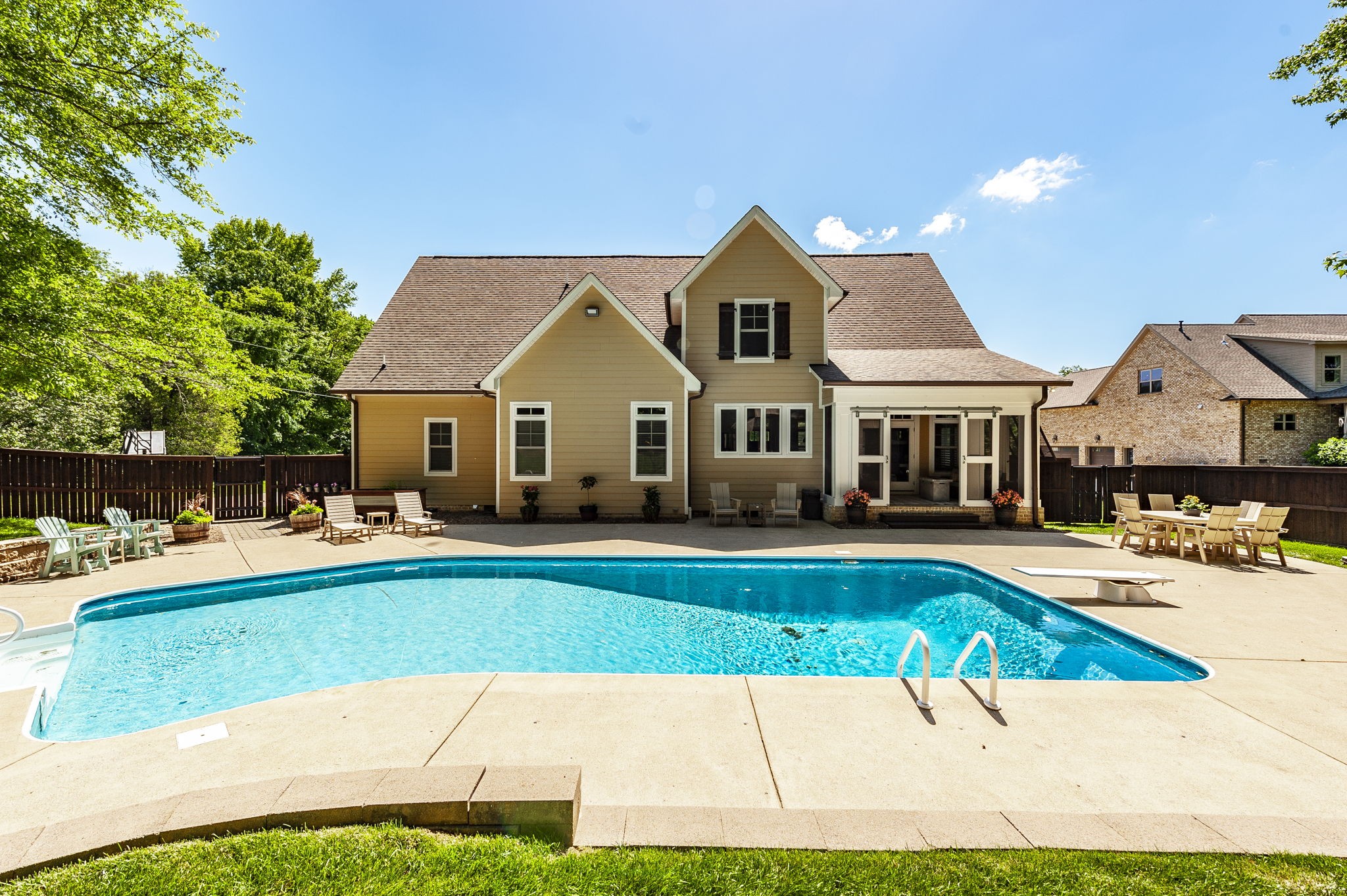 1956 Lake Road Greenbrier, TN 37073 - Photo 54 of 70 a front view of a house with swimming pool having outdoor seating
