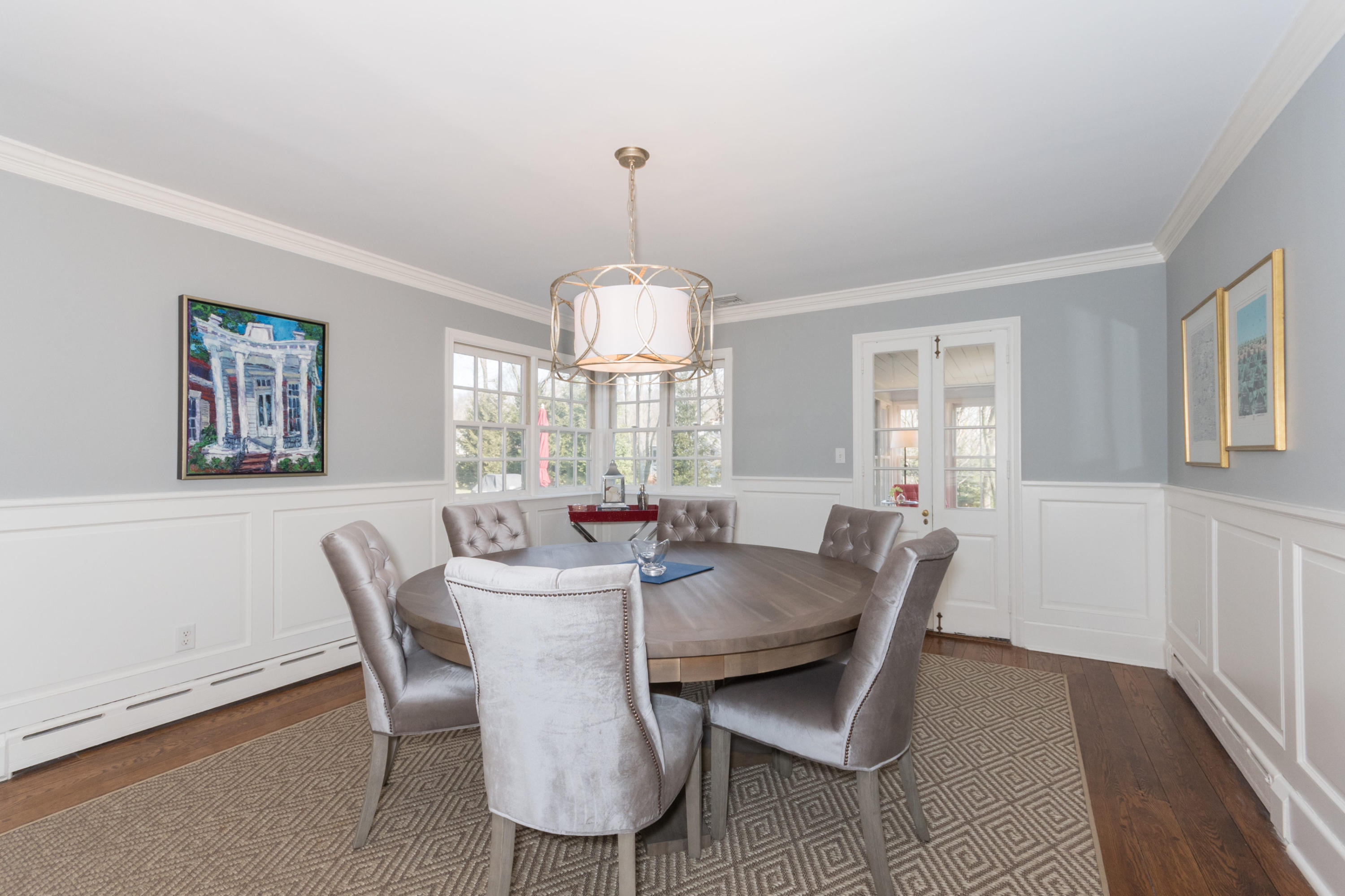 17 Point O Woods Road Darien, CT 06820 - Photo 11 of 44 a view of a dining room with furniture a chandelier and wooden floor