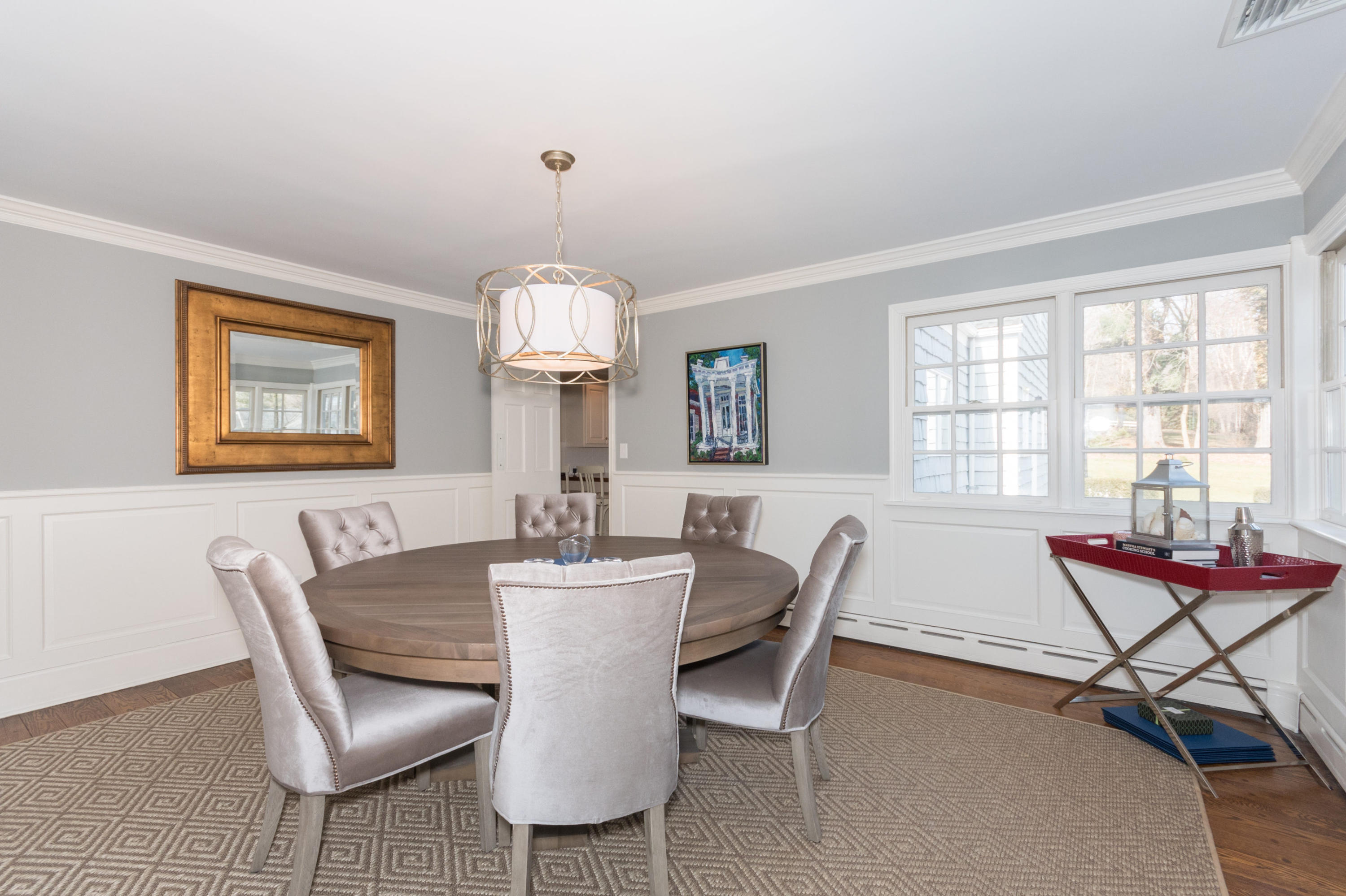 17 Point O Woods Road Darien, CT 06820 - Photo 12 of 44 a dining room with furniture a chandelier and wooden floor