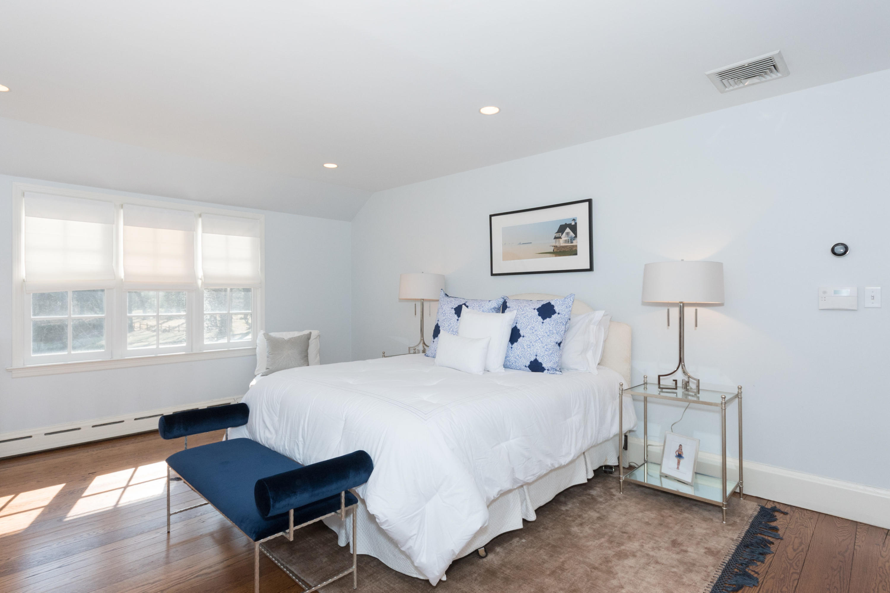 17 Point O Woods Road Darien, CT 06820 - Photo 20 of 44 a bedroom with a bed and a table in it with window