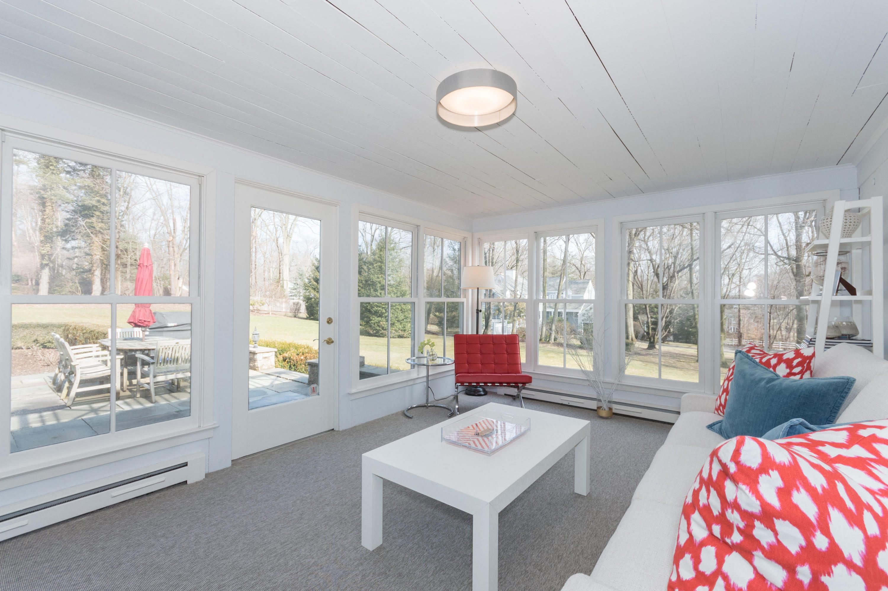 17 Point O Woods Road Darien, CT 06820 - Photo 24 of 44 a living room with furniture and large windows