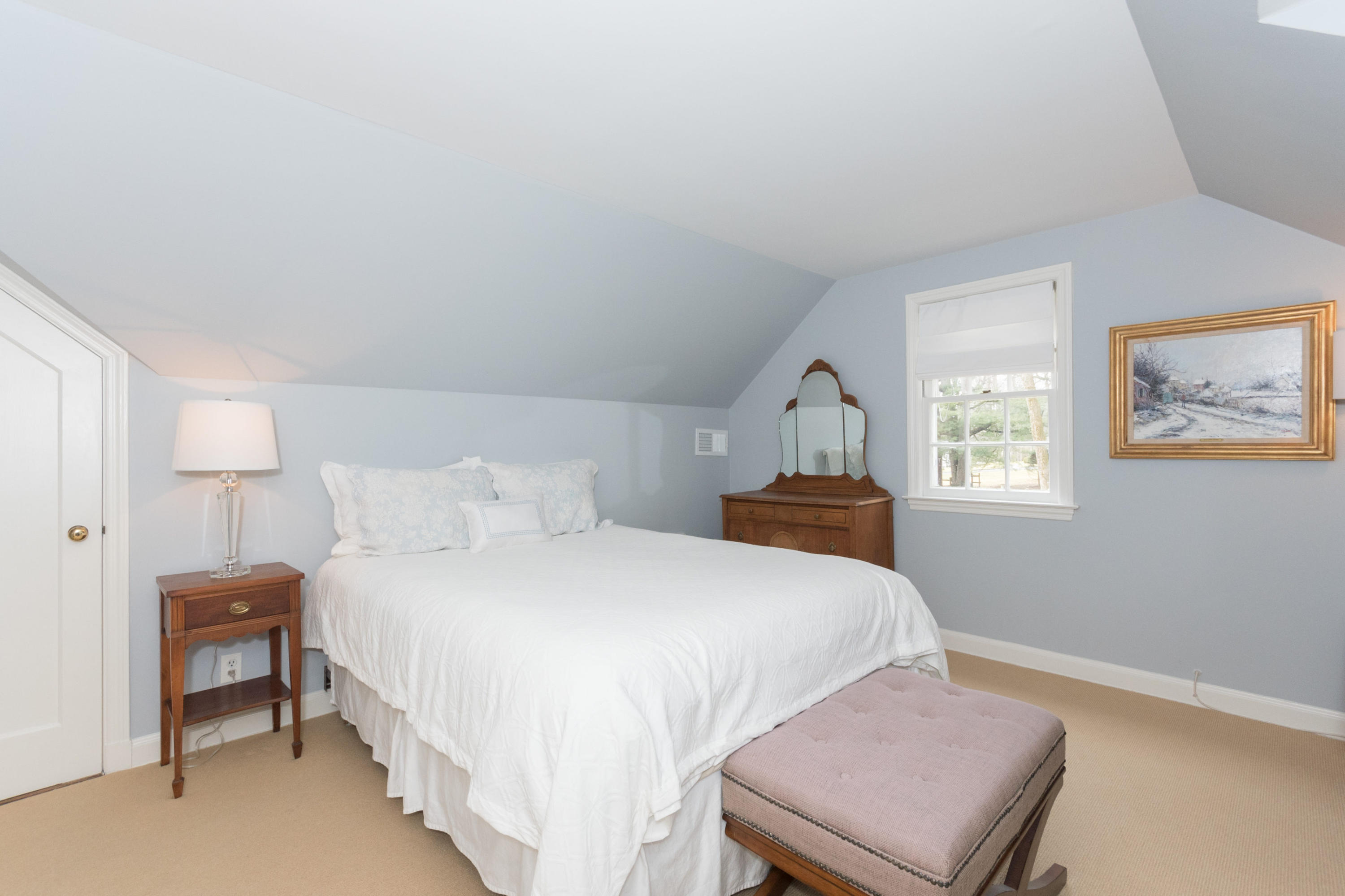 17 Point O Woods Road Darien, CT 06820 - Photo 27 of 44 a bedroom with a bed and a window