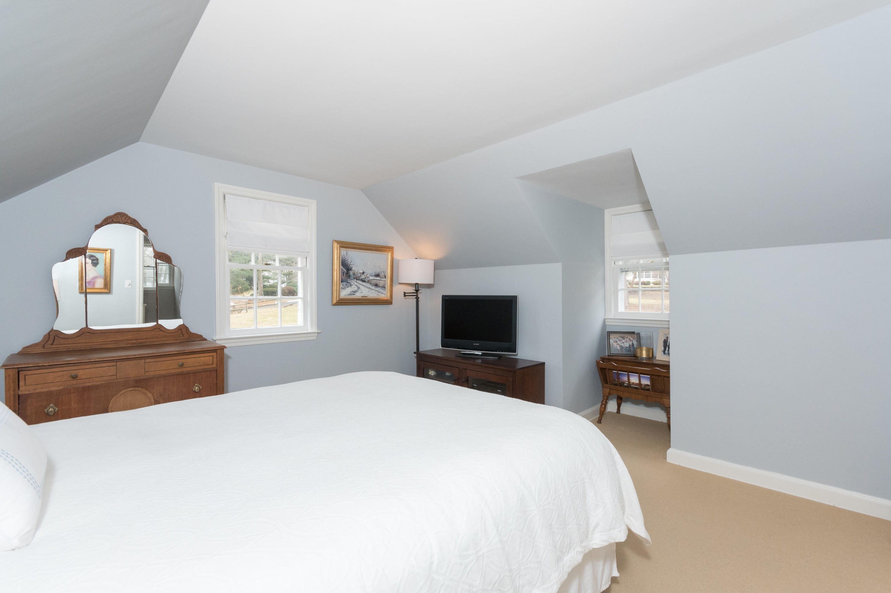 17 Point O Woods Road Darien, CT 06820 - Photo 28 of 44 a bedroom with a bed and a flat screen tv