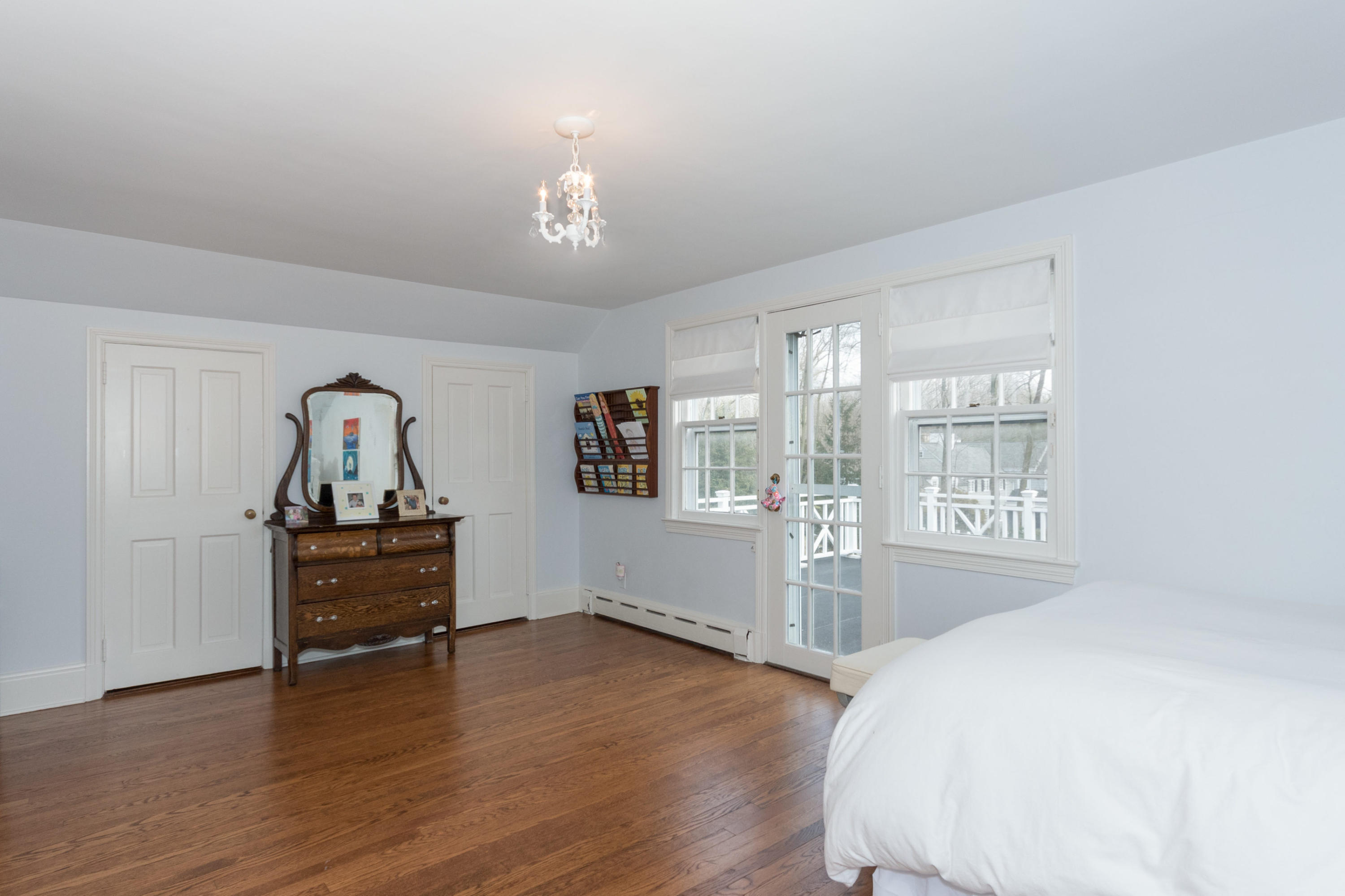 17 Point O Woods Road Darien, CT 06820 - Photo 35 of 44 a view of a livingroom with furniture wooden floor chandelier and a window