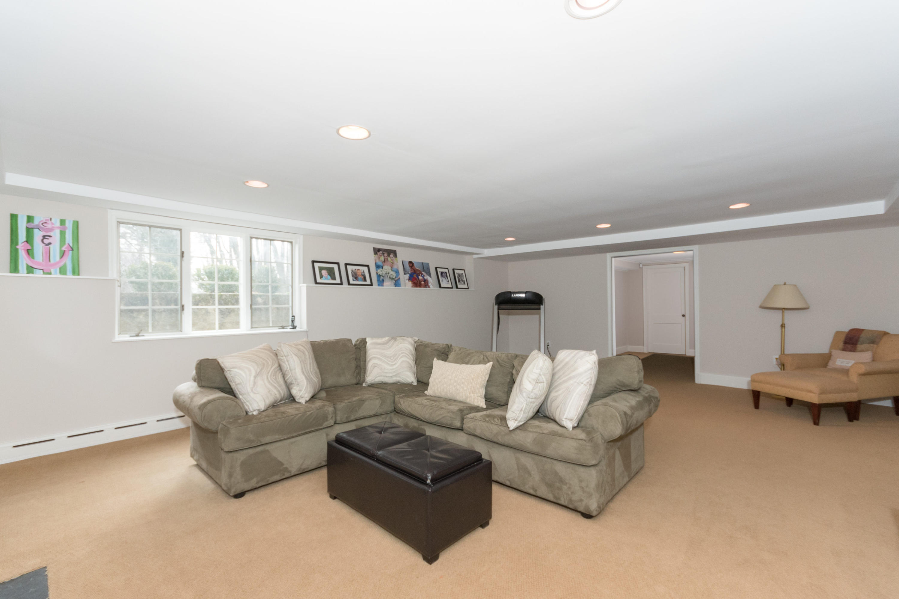 17 Point O Woods Road Darien, CT 06820 - Photo 36 of 44 a living room with furniture and a large window