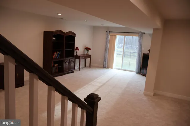 a view of livingroom with furniture and workspace