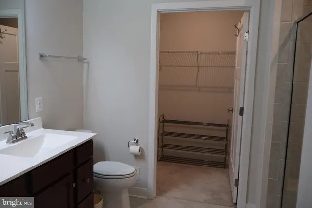 a bathroom with a sink toilet and vanity