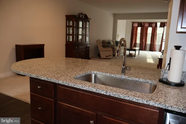 a kitchen with granite countertop a sink and a granite counter tops