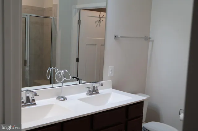 a bathroom with a sink toilet and vanity