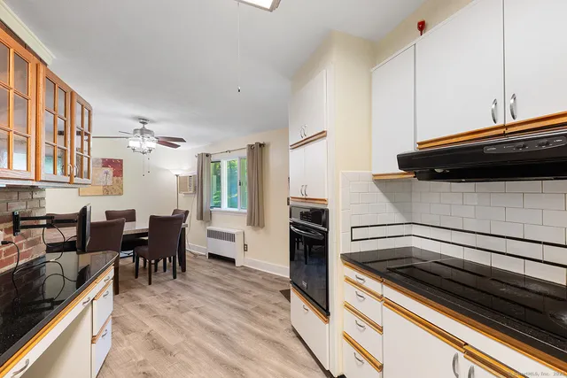 a kitchen with a sink and a large window