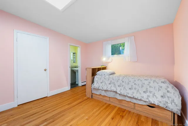 a bathroom with a granite countertop sink and a bathtub