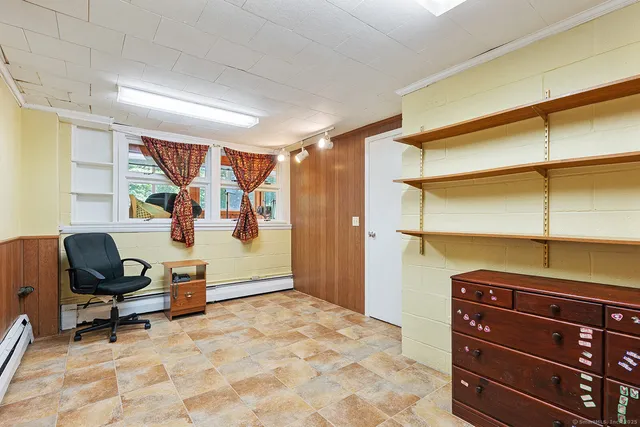 a bathroom with a double vanity sink mirror and toilet