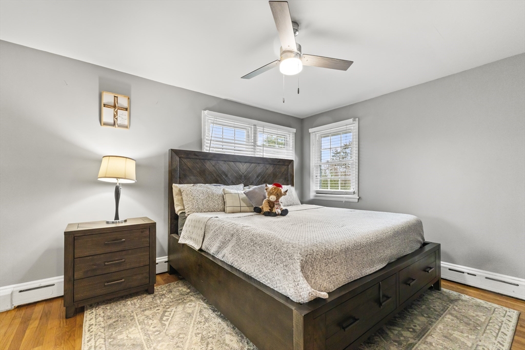 337 Lepes Road Somerset, MA 02726 - Photo 11 of 29 a bedroom with a bed and a lamp