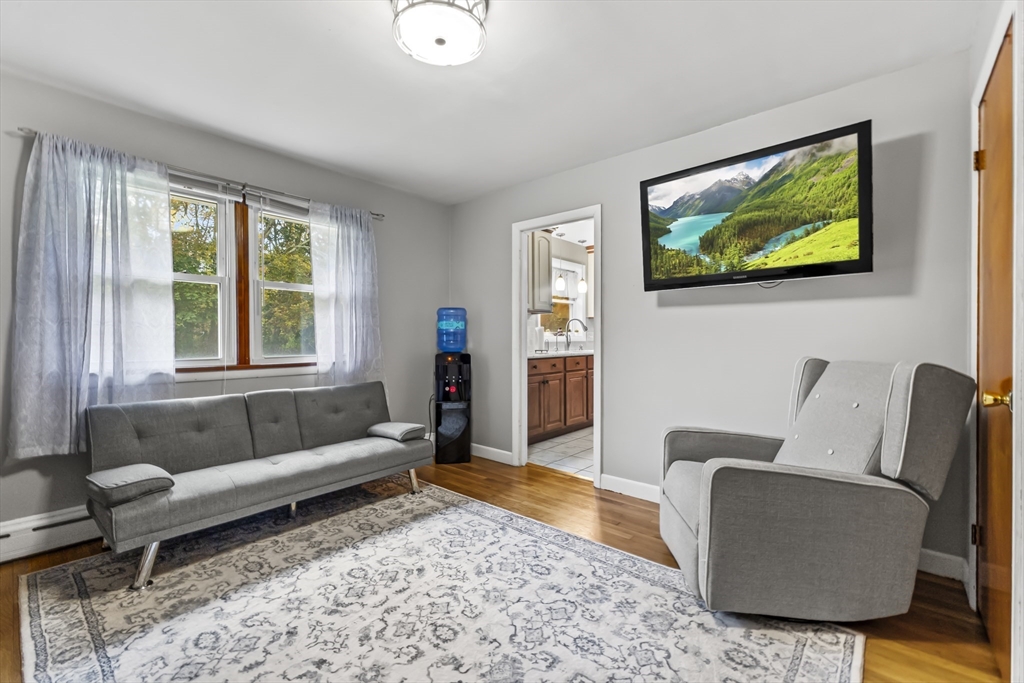 337 Lepes Road Somerset, MA 02726 - Photo 16 of 29 a living room with furniture and a flat screen tv