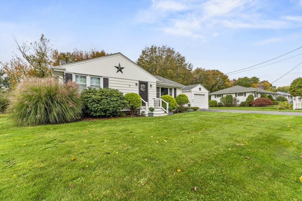 337 Lepes Road Somerset, MA 02726 - Photo 2 of 29 a front view of a house with garden